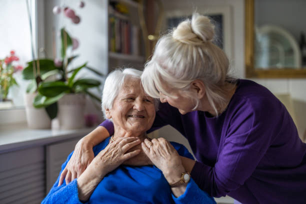 Elderly person and a care taker