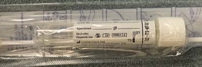 "Closeup image of a swab and specimen collection tube in a sterile wrapping. "