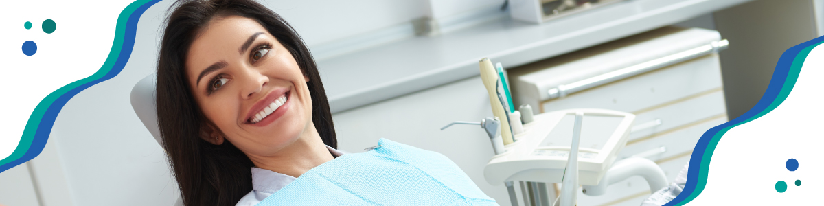 Woman smiling in dental exam chair